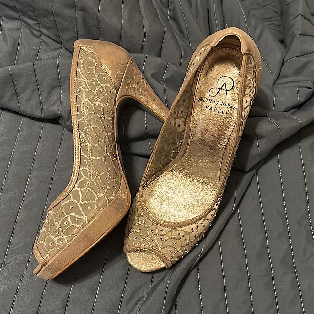 Metallic silver. 4 inch heels. Worn once.